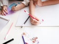 Kids are drawing picture with color pencil