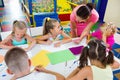 Kids drawing together with tutor at hobby group Royalty Free Stock Photo