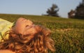 Kids dreaming. Child boy enjoying on grass field and dreaming. Kids play on summer field. Royalty Free Stock Photo