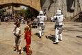 Kids dressed up as Star Wars characters chase off Storm Troopers at Disney World`s Galaxy`s Edge at Hollywood Studios Royalty Free Stock Photo