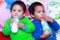 Kids drink bottled formula milk Royalty Free Stock Photo