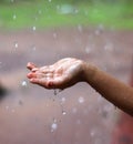 Kids Drizzling hands in rain water Royalty Free Stock Photo