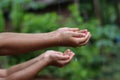 Kids Drizzling hands in rain water Royalty Free Stock Photo