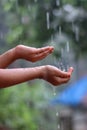 Kids Drizzling hands in rain water Royalty Free Stock Photo
