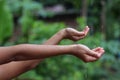 Kids Drizzling hands in rain water Royalty Free Stock Photo