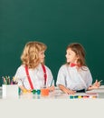 Kids early arts and crafts education. Portrait school kids doing art homework. Children drawing on elementary school. Royalty Free Stock Photo