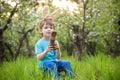 Kids on Easter egg hunt in blooming spring garden. Children searching for colorful eggs in flower meadow. Toddler boy and his brot Royalty Free Stock Photo