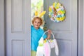 Kids Easter egg hunt. Child and eggs, bunny ears Royalty Free Stock Photo