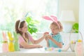 Kids on Easter egg hunt. Children dye eggs Royalty Free Stock Photo