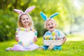 Kids on Easter egg hunt Royalty Free Stock Photo