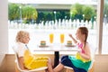 Kids eat cake at restaurant. Boy and girl in cafe. Royalty Free Stock Photo