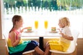 Kids eat cake at restaurant. Boy and girl in cafe Royalty Free Stock Photo