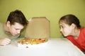 Kids eat pizza