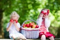 Kids eating apple in the garden Royalty Free Stock Photo