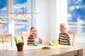 Kids eating breakfast at home. Fruit and milk for children. Royalty Free Stock Photo