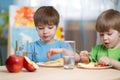 Kids eating healthy food at home Royalty Free Stock Photo