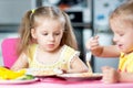 Kids eating in kindergarten or at home Royalty Free Stock Photo