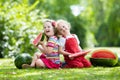 Kids eating watermelon in the garden Royalty Free Stock Photo