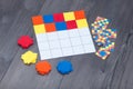 Kids education game at home. Colored textile squares put as same as in sample