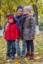 Kids embracing among autumn park Royalty Free Stock Photo