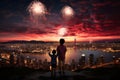 Kids enjoying fireworks over city skyline silhouetted against sunset sky Royalty Free Stock Photo