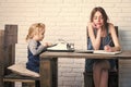 Kids enyoj happy day. Girl and child sitting at table