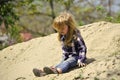 Kids enyoj happy day. Toddler slide from pile of sand on idyllic sunny day Royalty Free Stock Photo