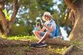 Kids explore nature. Children hike in sunny park Royalty Free Stock Photo