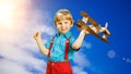 Kids fantasy. Child playing with toy airplane against sky and cl Royalty Free Stock Photo