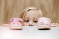 Kids, fashion and shoes with a girl choosing between footwear while shopping in a retail store. Children, cute and Royalty Free Stock Photo