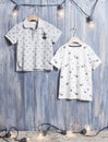 Kids fashion - two kids t-shirts on wooden background