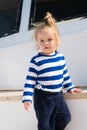 Kids fashion on vacation. Boy adorable sailor striped shirt yacht travel around world. Baby boy enjoy vacation cruise