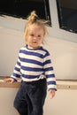 Kids fashion on vacation. Boy adorable sailor striped shirt yacht travel around world. Baby boy enjoy vacation cruise