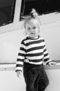 Kids fashion on vacation. Boy adorable sailor striped shirt yacht travel around world. Baby boy enjoy vacation cruise