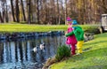 Kids feeding ducks in autumn park Royalty Free Stock Photo