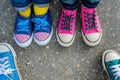 kids feet with mismatched shoes, deciding which to choose Royalty Free Stock Photo