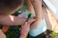 Kids feet under shower near pool. Parent wash their child feet Royalty Free Stock Photo