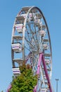 kids ferris wheel at the amusement park, blue sky Royalty Free Stock Photo