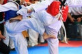 Kids fighting on stage during Taekwondo contest