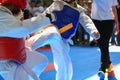 Kids fighting on stage during Taekwondo contest