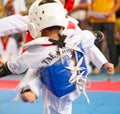 Kids fighting on stage during Taekwondo contest