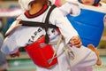 Kids fighting on stage during Taekwondo contest