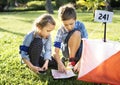 Kids finding direction on a map Royalty Free Stock Photo