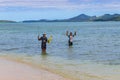 kids fishing at the beach