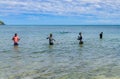 kids fishing at the beach