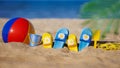 Kids flip-flops, beach ball and snorkel on the sand. Summer vacation concept Royalty Free Stock Photo