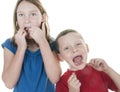 Kids flossing teeth Royalty Free Stock Photo