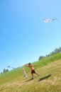 Kids flying kites high up Royalty Free Stock Photo