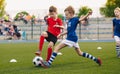 Kids Football Players Kicking Ball on Soccer Field. Sports Soccer Horizontal Background Royalty Free Stock Photo