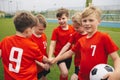 Kids on Football Soccer Team Putting Hands in. Boys Football School Team Huddling Royalty Free Stock Photo